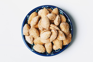 Roasted salted almond nuts in nutshell