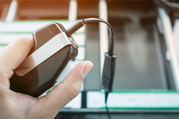 Air traffic controller's hand pushing push to talk button