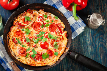 Frittata made of eggs, sausage chorizo, red pepper, green pepper
