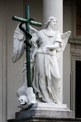 Naklejka premium Detail of the Old Testament Angel sculpture at the entrance or the Karlskirche (Saint Charles Church) in Vienna, Austria, seen from Karlsplatz