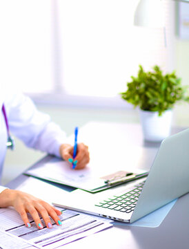 Portrait of happy medical doctor woman in office