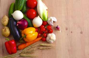 Pile of organic vegetables on a wooden table