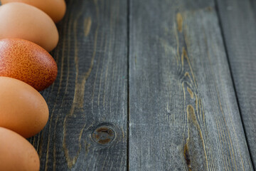 chicken eggs on wooden background