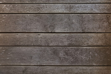 Old dark brown wooden fence background texture