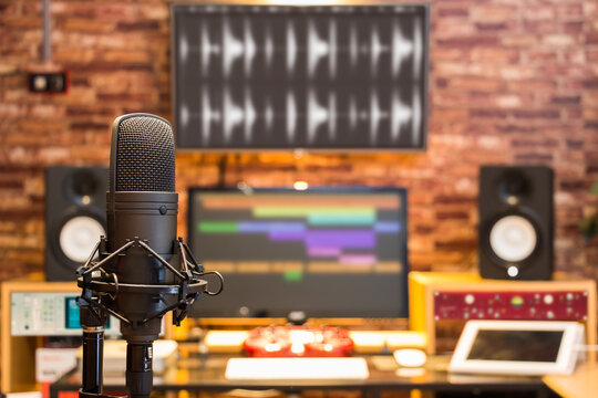 condenser microphone on digital recording studio background