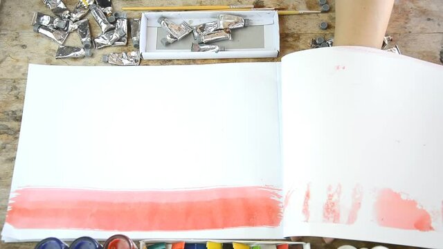 Woman tering sheet of paper for your presentation or text on notebook  (presentation concept)