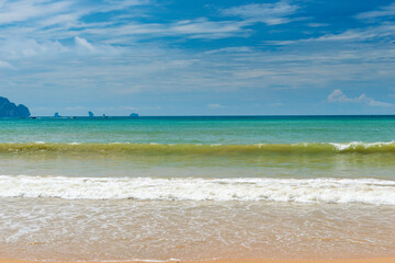 Empty sandy beach and turquoise sea, view of the horizon