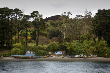 Fototapeta na wymiar Puerto Montt, Chile-October 17, 2014: Fishing boats moored in Angelmo, tourist area and restaurant specialists in cooking fish