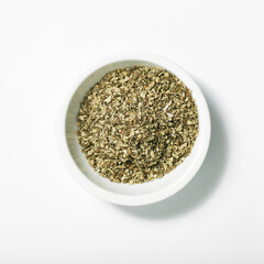 Bowl of dried oregano leaves