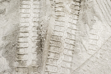 tyre tracks on the white sand in construction site