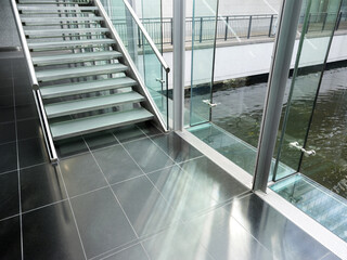Obraz premium marble floor with stairs and glass pane of modern architecture