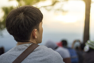 back of people on top of mountain