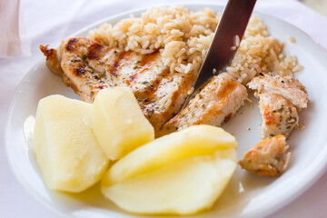 Grilled chicken fillt with potatoes and rice for kids
