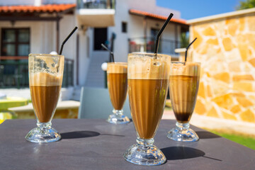 Glasses of freppe - greek cold iced coffee on table