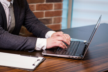 Businessman Working Laptop Connecting Networking Concept,Businessman working with documents on office desk.Business concept.Close up