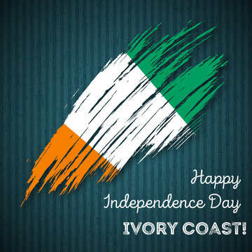 Ivory Coast Independence Day Patriotic Design. Expressive Brush Stroke in National Flag Colors on dark striped background. Happy Independence Day Ivory Coast Vector Greeting Card.