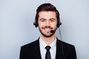 Close up portrait of happy with beaming smile man in formal wear working in call center