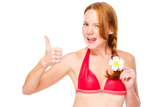 Funny girl in bikini with plumer in hair on white background posing