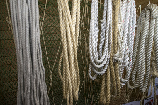a set of ropes and nets on a fishing boat