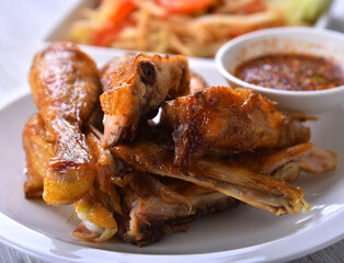 Grilled chicken in white dish