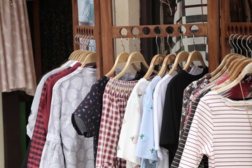 Fototapeta premium Shop clothes on hangers