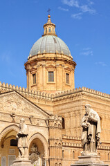 Fototapeta na wymiar Dome of the Cathedral and statues of two prophets on Via Matteo Bonello - Palermo, Sicily, Italy