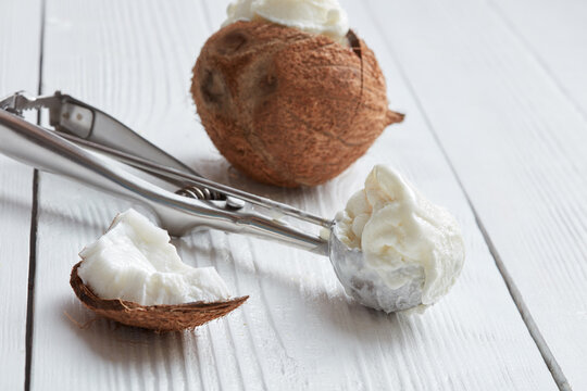 Coconut ice cream in a metal spoon