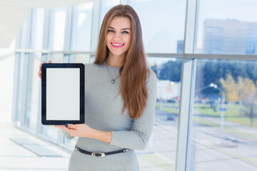 Businesswoman holds a tablet in his hands at the office