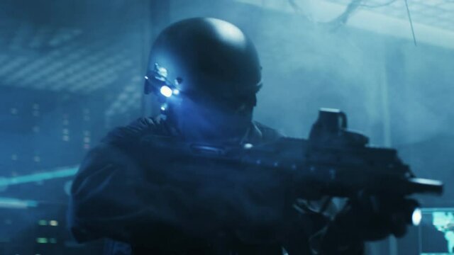 Special Forces Armed Soldier Searches Hacker's Secret Hideout, He's Ready To Shoot. He Searches the Place and Sees Multiple Working Displays, Cables. Shot on RED EPIC-W 8K Helium Cinema Camera.