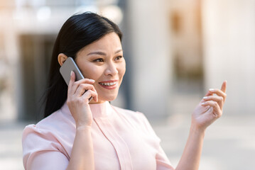 Happy lady telling by phone