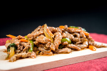 wok fried beef stir fry with sweet peppers and chinese vegetables