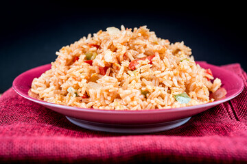 Homemade Chinese fried rice with vegetables and fried eggs