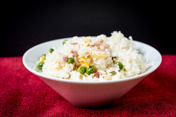 Homemade Chinese fried rice with vegetables and fried eggs