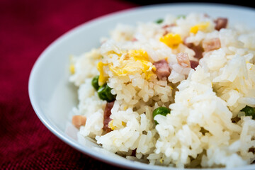 Homemade Chinese fried rice with vegetables and fried eggs