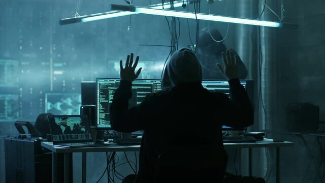 Fully Armed Special Cybersecurity Forces Soldier Arrests Highly Dangerous Hacker. Hideout is Dark and Full of Computer Equipment. Shot on RED EPIC-W 8K Helium Cinema Camera.