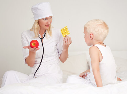 doctor giving apple and pills