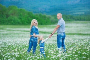 happy family having fun outdoors. Portrait of happy family in countryside Happy people outdoors wearing jeans enjoying time together