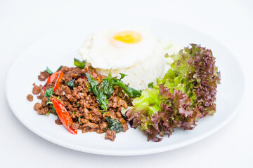 Stir-fried minced pork with fried egg and steamed rice (Thai food)