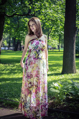 Pregnant woman walking in the park