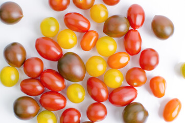 Mix Of Different Sorts Cherry Tomatoes On White Background Closeup Shot From The Above