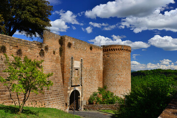 Fototapeta na wymiar Orvieto ancient medieval walls with clouds