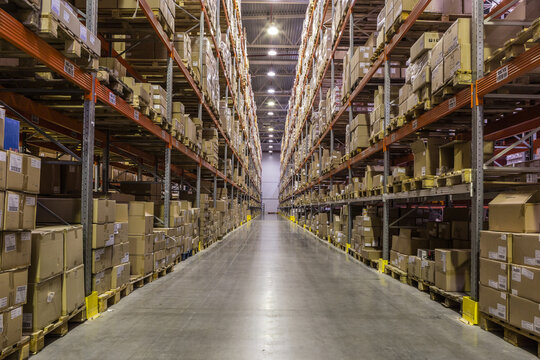Interior of warehouse with racks full of boxes and goods