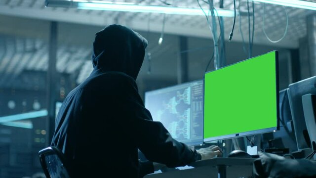 Team of Internationally Wanted Teenage Hackers with Green Screen Mock-up Display Infect Servers and Infrastructure with Malware.  Shot on RED EPIC-W 8K Helium Cinema Camera.