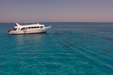 Tourists boat anchored in a bay in the red sea for snorkeling,luxury yacht.
