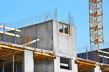 Crane and highrise construction site