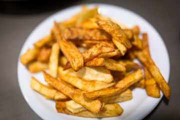 Greek chips fried in olive oil on the plate