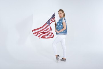 young caucasian woman posing and waving USA flag, Independence Day Celebration