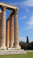 Photo of iconic pillars of Temple of Olympian Zeus with view to the Acropolis and the Parthenon, Athens historic center, Attica, Greece 