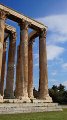 Fototapeta premium Photo of iconic pillars of Temple of Olympian Zeus with view to the Acropolis and the Parthenon, Athens historic center, Attica, Greece 