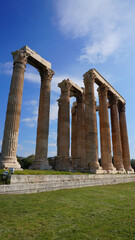 Fototapeta premium Photo of iconic pillars of Temple of Olympian Zeus with view to the Acropolis and the Parthenon, Athens historic center, Attica, Greece 